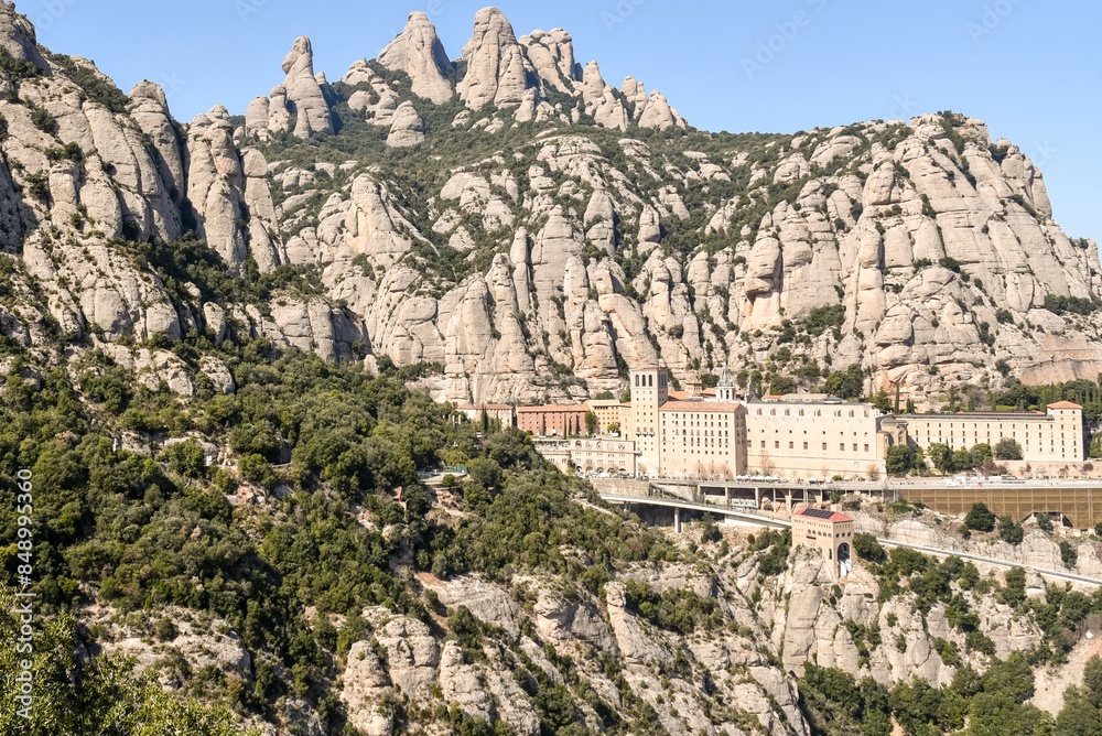 view of the monastery of montserrat in catalonia spain against a beautiful rocky mountain
