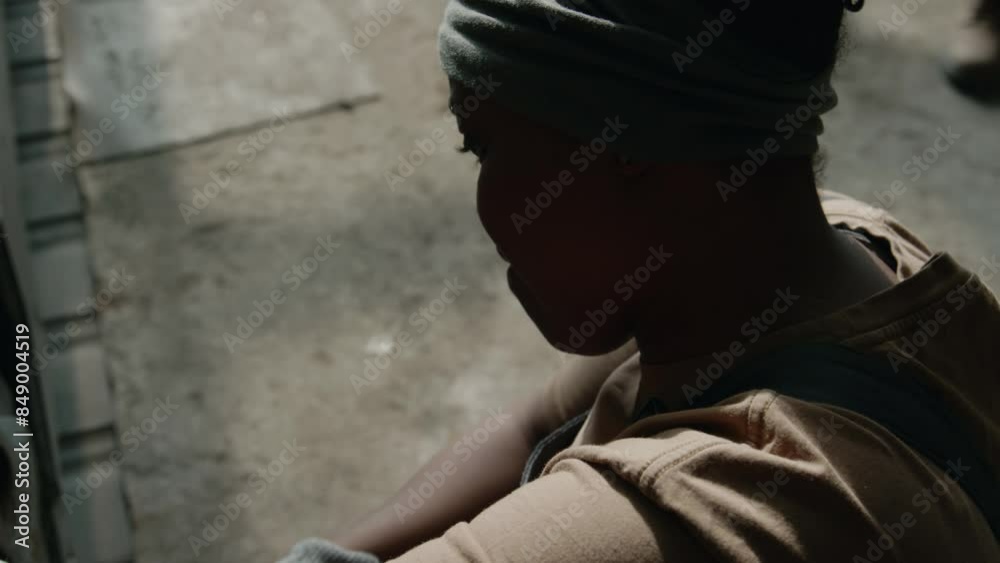 High angle close up view of professional female mechanic working with wrench while repairing industrial machinery at plant High angle close up view of professional female mechanic working with wrench while repairing industrial machinery at plant