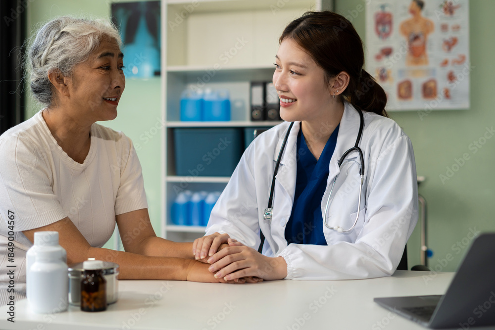 Friendly female doctor hands holding patient hand sitting at the desk for encouragement, empathy, cheering and support while medical examination. Friendly female doctor hands holding patient hand sitting at the desk for encouragement, empathy, cheering and support while medical examination.