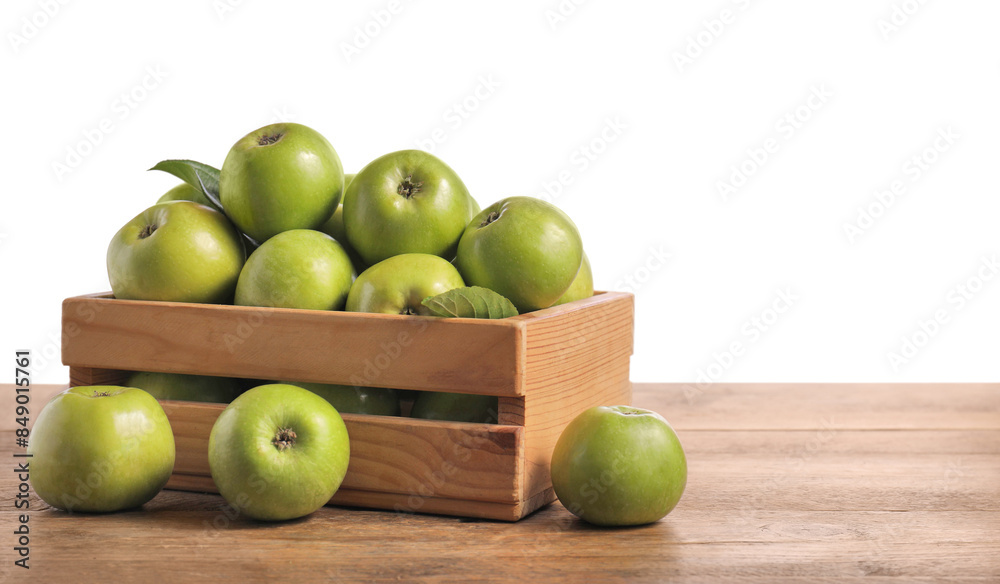 Ripe green apples in crate on wooden table against white background. Space for text Ripe green apples in crate on wooden table against white background. Space for text