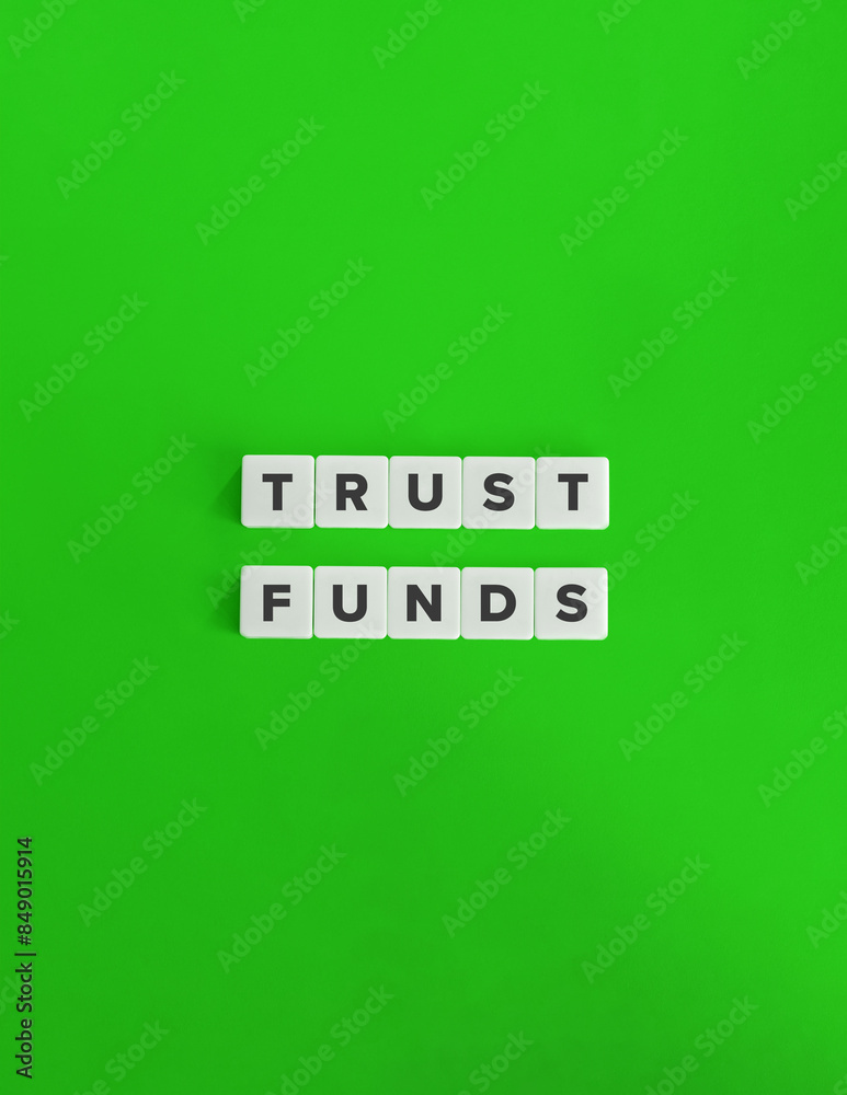 Trust Funds Term and Banner. Text on Block Letter Tiles on Flat Background with Copy Space. Minimal Aesthetics. Trust Funds Term and Banner. Text on Block Letter Tiles on Flat Background with Copy Space. Minimal Aesthetics.