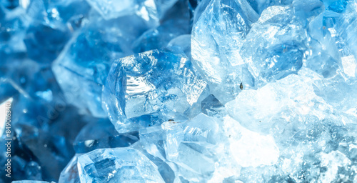 Blue Crystal Mineral Stone. Gems. Mineral crystals in the natural environment. Texture of precious and semiprecious stones. Seamless background with copy space colored shiny surface of precious stones