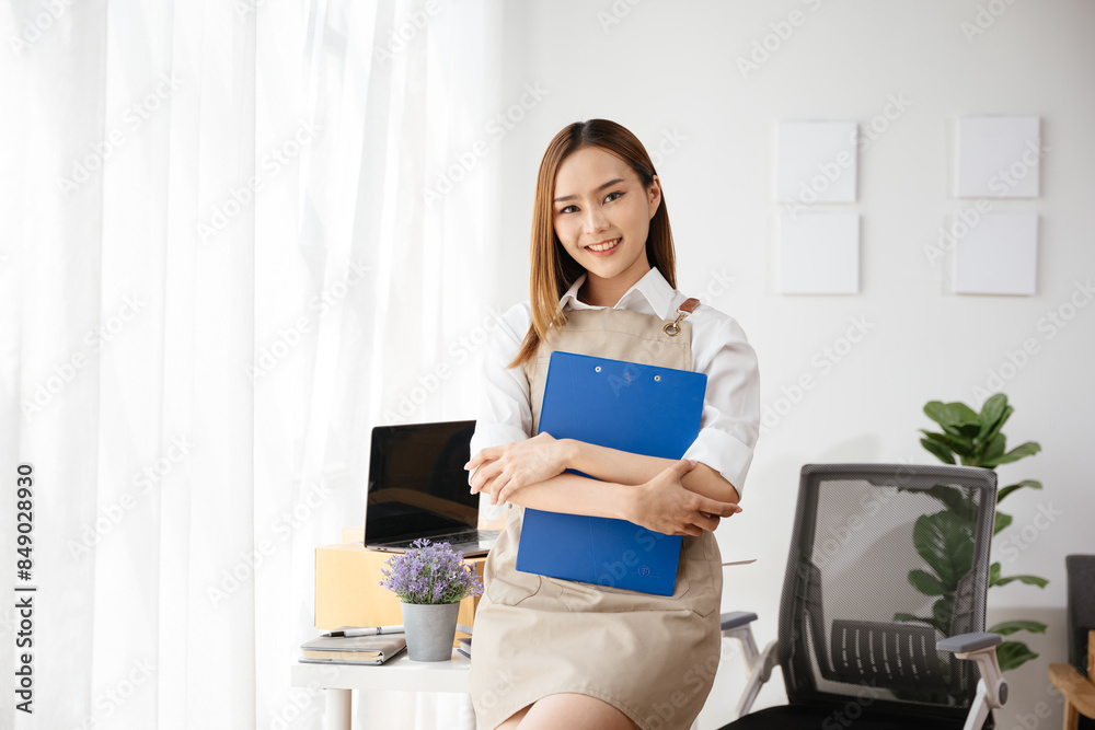 Professional businesswoman owner SME Small and Medium Enterprises cross her arms confidently with her products in parcel cardboard box packaging at home ready for delivery to customer Professional businesswoman owner SME Small and Medium Enterprises cross her arms confidently with her products in parcel cardboard box packaging at home ready for delivery to customer