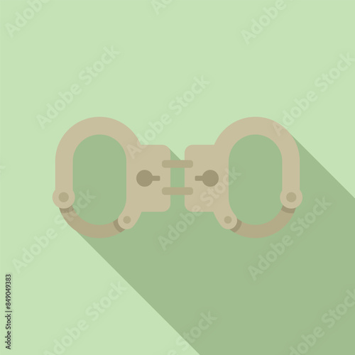 Pair of metal handcuffs lying closed, representing law enforcement and the capture of criminals