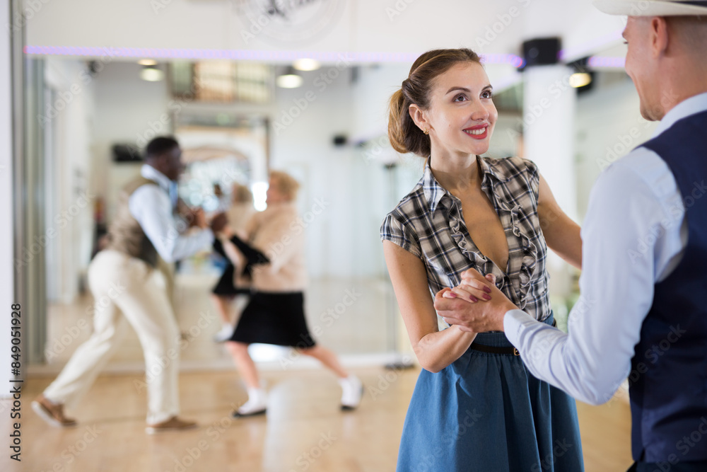Pair dancing lindy hop during rehearsal Pair dancing lindy hop during rehearsal