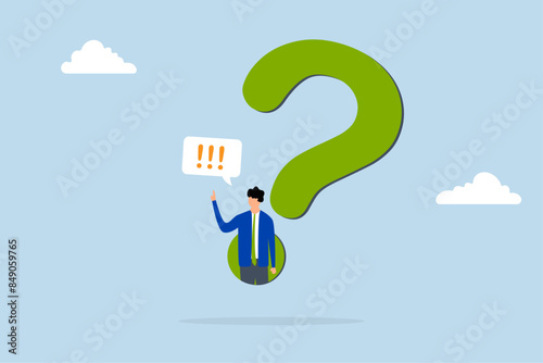 Answer business question, determination businessman comes out of  question mark to answer question.