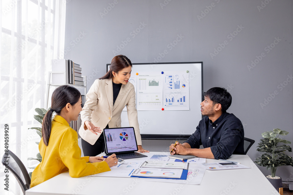 Group of casually dressed asian businesspeople discussing ideas in the office. Creative professionals gathered at the meeting table for discuss important issues of the new successful startup project	