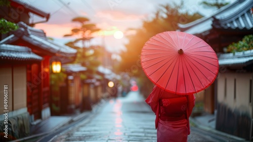 Woman with red umbrella in traditional Japanese street photo