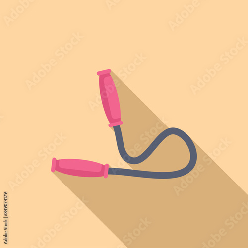 Pink skipping rope lying on yellow background with long shadow