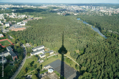 Aerial view on Vilija River and residential buildings with visible TV tower shadow photo