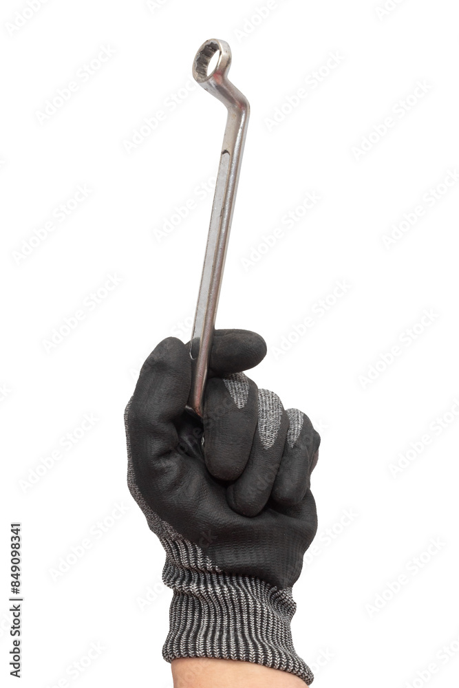 Hand of worker holding a ring spanner isolated on white background. Working glove. Hand of worker holding a ring spanner isolated on white background. Working glove.