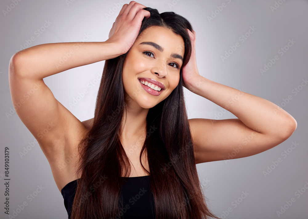 Portrait, smile and woman haircare in studio for growth, healthy shine and treatment transformation results. Pride, female person and beauty or straight hairstyle, keratin glow and grey background Portrait, smile and woman haircare in studio for growth, healthy shine and treatment transformation results. Pride, female person and beauty or straight hairstyle, keratin glow and grey background