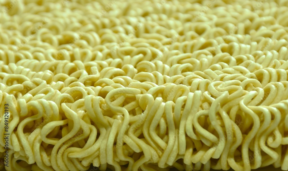 close up of raw dry instant noodles on white background close up of raw dry instant noodles on white background