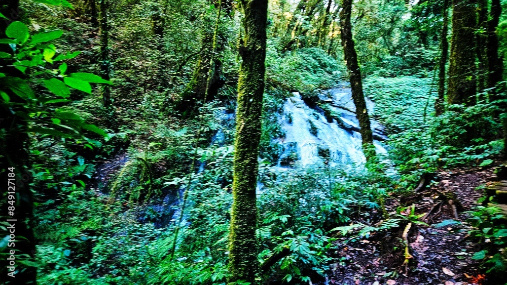 Waterfall in the tropical forest landscape in northern Thailand. Waterfall in the tropical forest landscape in northern Thailand.