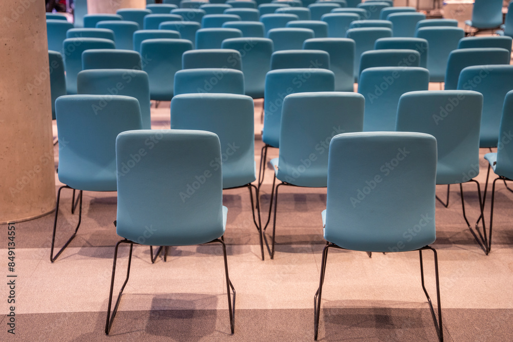 Fototapeta premium Rows of new blue chairs in the conference hall