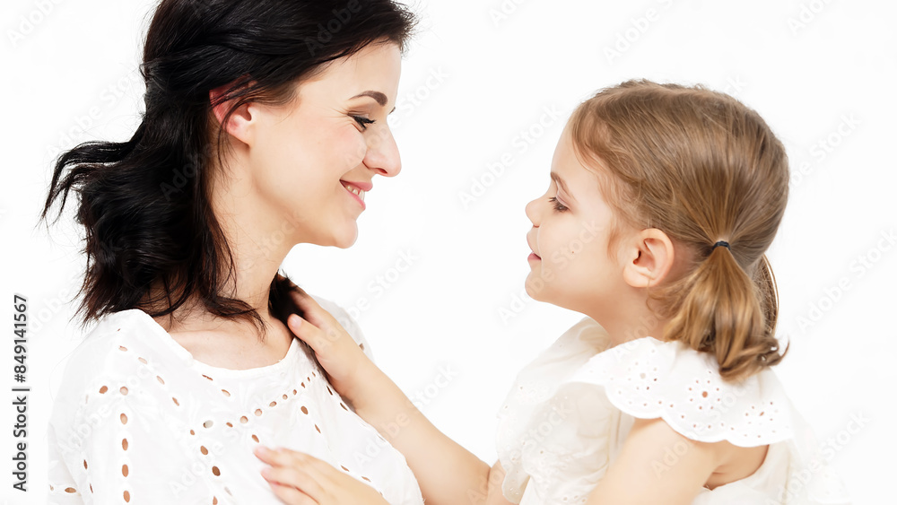 Sensual mother with her little daughter on a light studio background. Family relationship between mother and daughter. Tender moment, family support. Sensual mother with her little daughter on a light studio background. Family relationship between mother and daughter. Tender moment, family support.