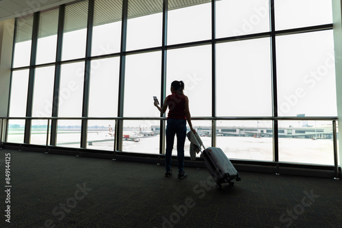 Female passenger waiting her flight at airport © tonjung