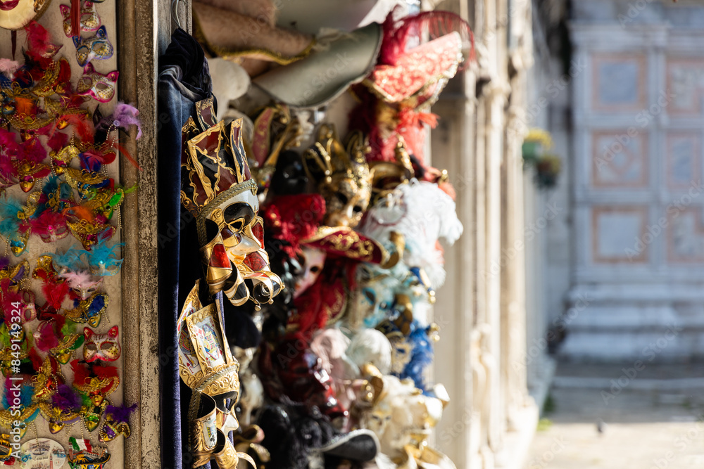 Masquerade masks hanging outside a shop in Venice, Italy Masquerade masks hanging outside a shop in Venice, Italy
