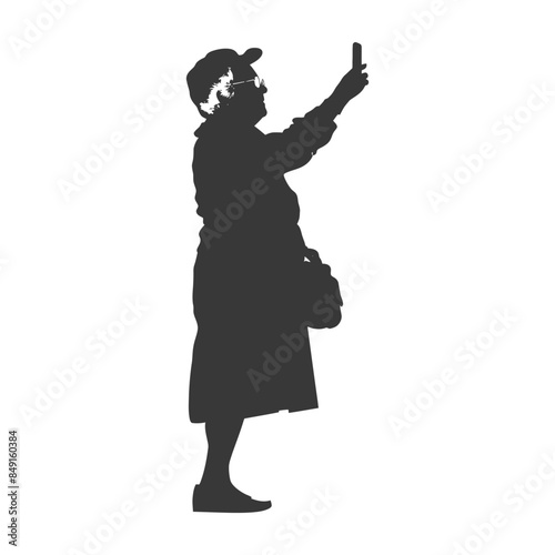 Silhouette of senior woman taking selfie with phone, cap and purse.