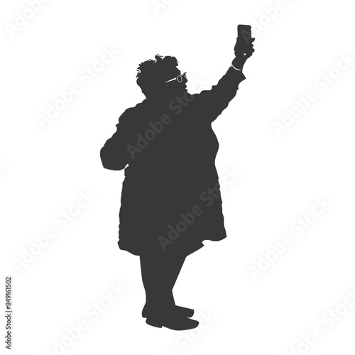 Silhouette of older woman taking a selfie.