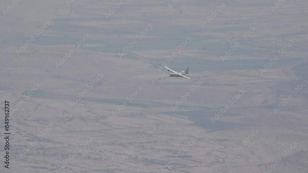 Airplane flying through haze high above the ground Airplane flying through haze high above the ground