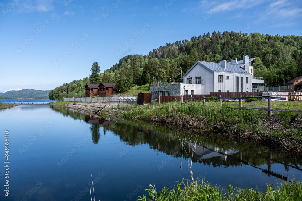 typical summer landscape with mountains, lake and forest in the area of Lake Teletskoye in Altai typical summer landscape with mountains, lake and forest in the area of Lake Teletskoye in Altai
