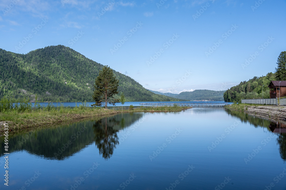 typical summer landscape with mountains, lake and forest in the area of Lake Teletskoye in Altai typical summer landscape with mountains, lake and forest in the area of Lake Teletskoye in Altai