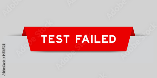 Red color inserted label with word test failed on gray background