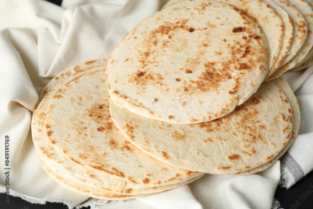 Tasty homemade tortillas and cloth on table Tasty homemade tortillas and cloth on table