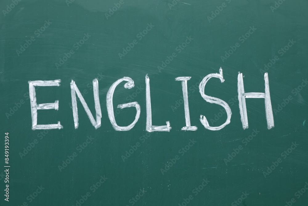 Word English written with chalk on green board Word English written with chalk on green board