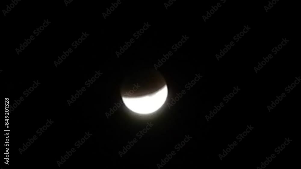 Dark night sky with clouds and Supermoon during total lunar eclipse that occurred in month of September 2015 called Harvest Moon - timelapse. Topics: space, astronomy, light, cosmos, weather Dark night sky with clouds and Supermoon during total lunar eclipse that occurred in month of September 2015 called Harvest Moon - timelapse. Topics: space, astronomy, light, cosmos, weather
