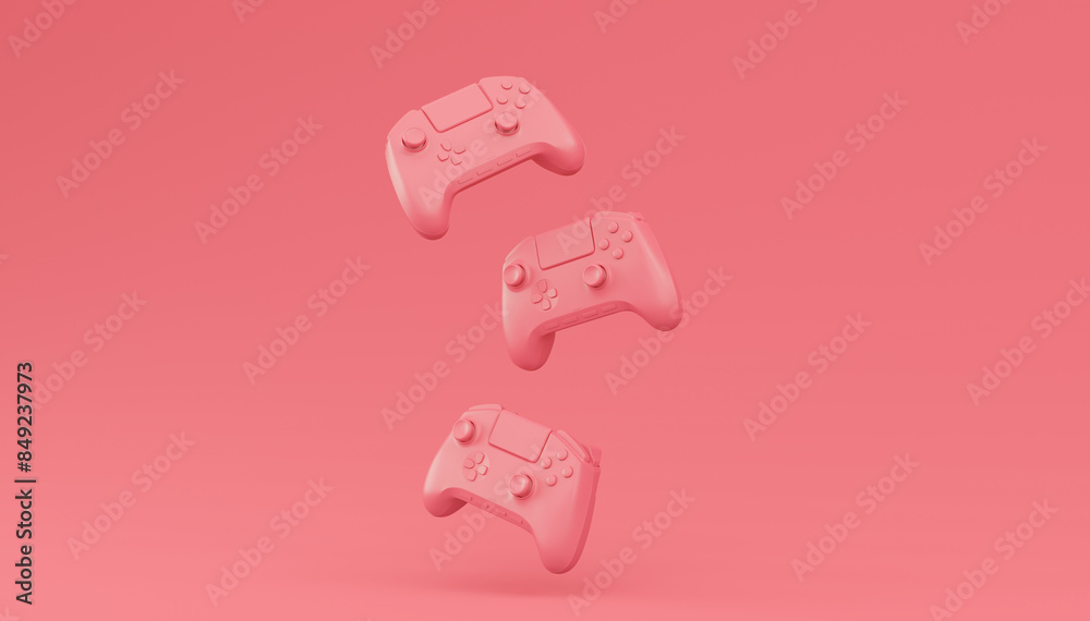 Video game joysticks or gamepads in plain monochrome pink color background Video game joysticks or gamepads in plain monochrome pink color background