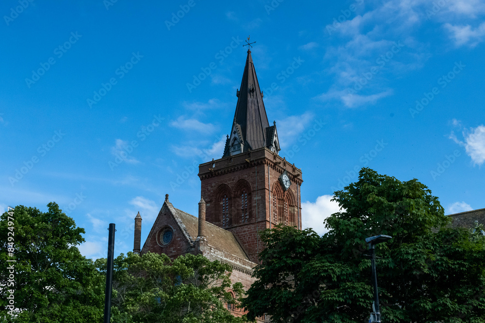 Kirkwall cathedral of Scotland clock tower church in the shining sun Kirkwall cathedral of Scotland clock tower church in the shining sun