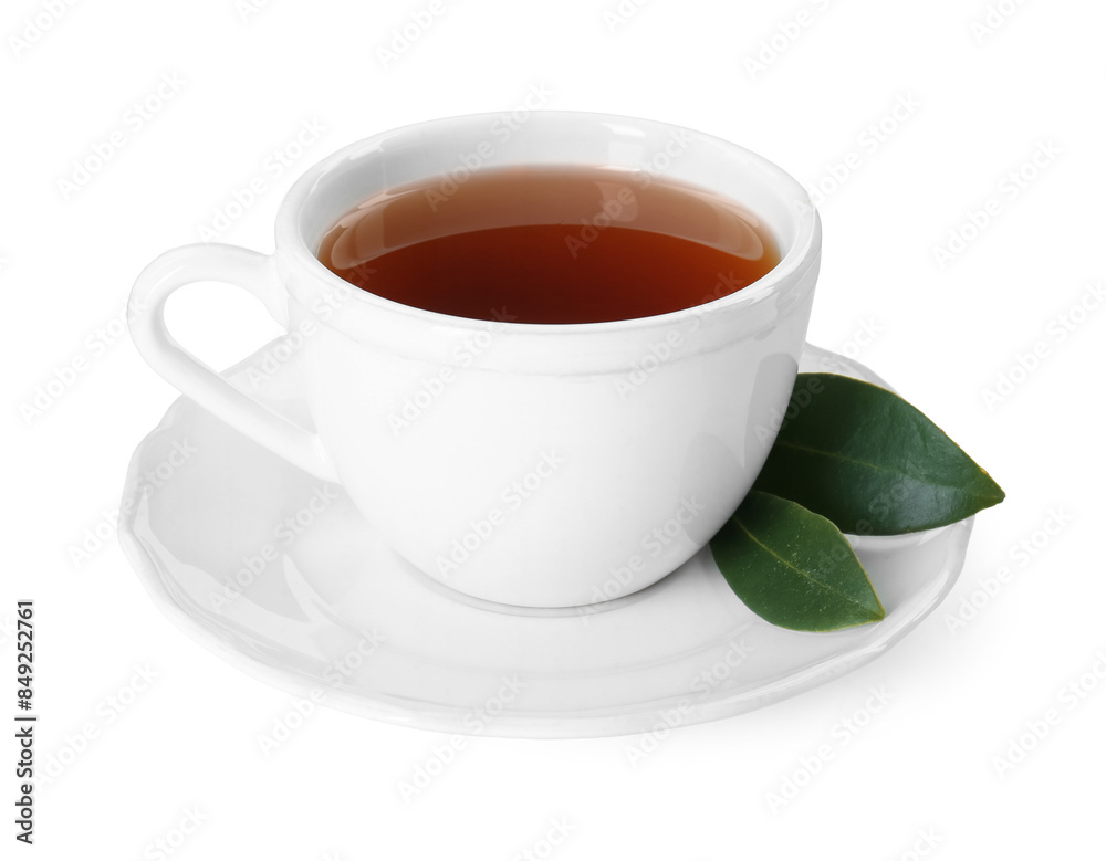 Aromatic tea in cup and green leaves isolated on white Aromatic tea in cup and green leaves isolated on white
