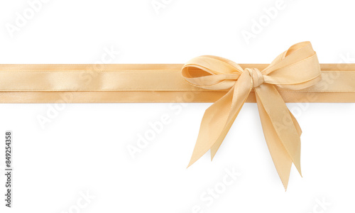 Golden satin ribbons with bow isolated on white, top view