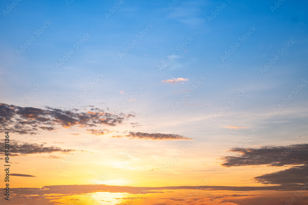 Fototapeta premium Beautiful , luxury soft gradient orange gold clouds and sunlight on the blue sky perfect for the background, take in everning,Twilight, Large size, high definition landscape photo