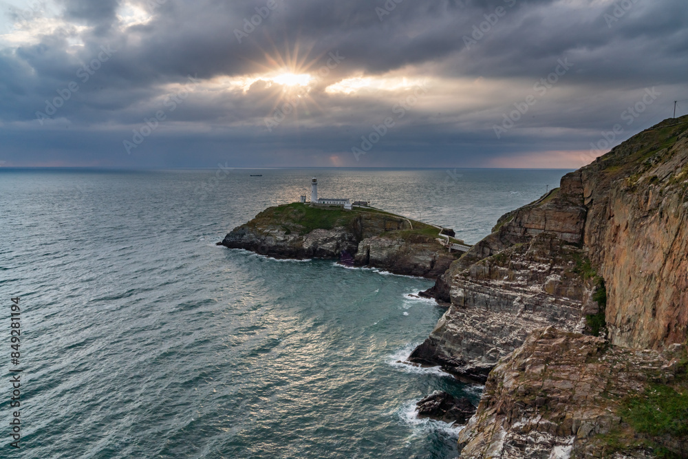 Fototapeta premium Sun beams around South Stack Lighthouse