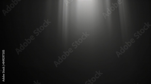 Dark blue brushed metal surface with a spotlight hit  highlights its shiny texture