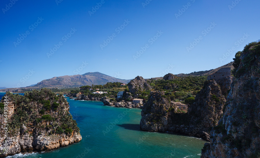 View across tranquil cove to the Faraglioni, Scopello View across tranquil cove to the Faraglioni, Scopello