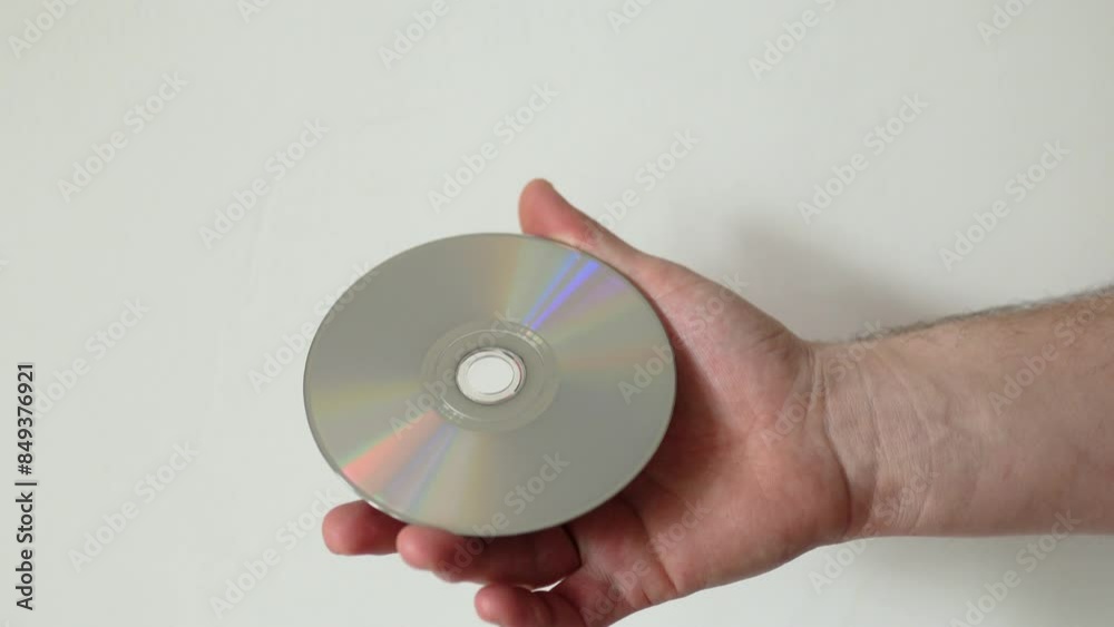 Hand holding cd disc. Physical media concept. Hand holding cd disc. Physical media concept.