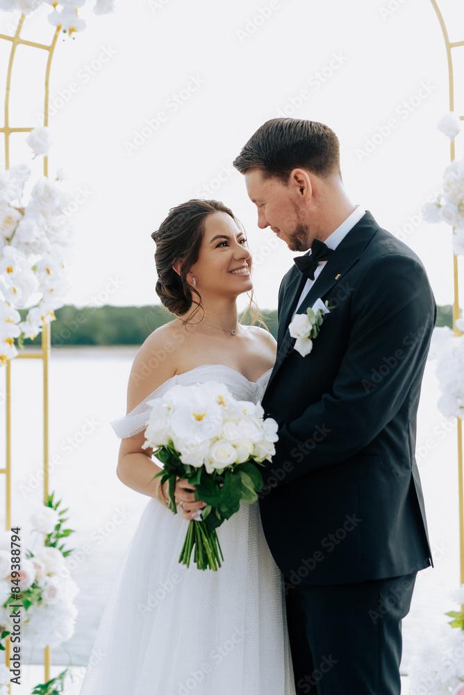 wedding ceremony of the newlyweds on the pier