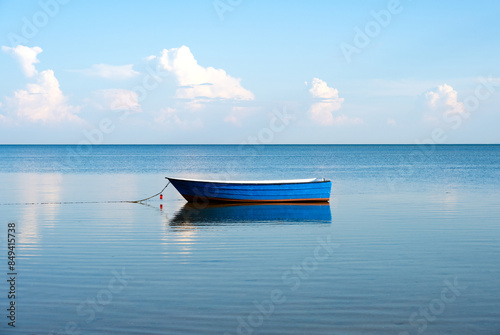 Obraz na płótnie lonely fish boat on calm Baltic sea on Bay of Puck from Hel peninsula in Poland w salonie