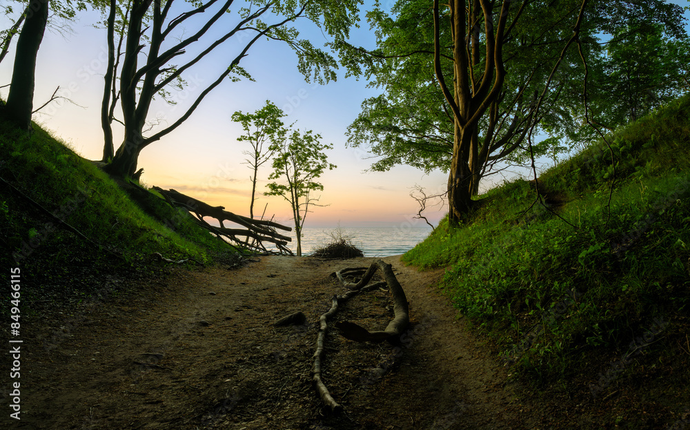 entry on beach of Baltic sea during sunset in Poland
