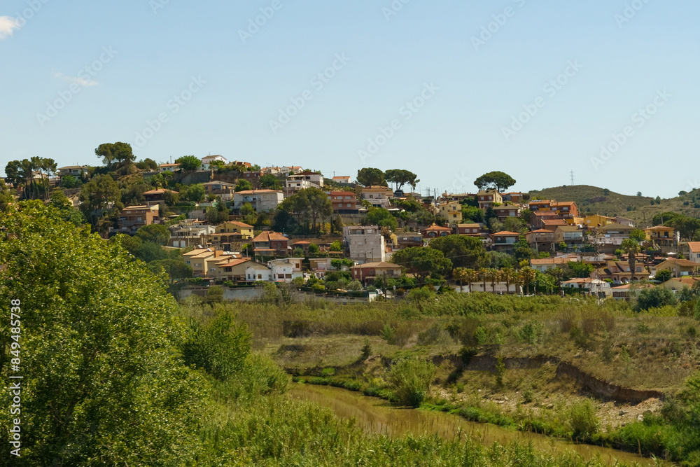 Hillside Village in Spain With Lush Vegetation and a Stream Hillside Village in Spain With Lush Vegetation and a Stream