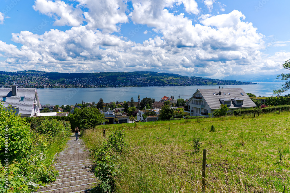 Scenic landscape with view over Lake Zurich seen from hill at Swiss village of Rüschlikon on a sunny spring noon. Photo taken June 12th, 2024, Rüschlikon, Canton Zürich, Switzerland. Scenic landscape with view over Lake Zurich seen from hill at Swiss village of Rüschlikon on a sunny spring noon. Photo taken June 12th, 2024, Rüschlikon, Canton Zürich, Switzerland.