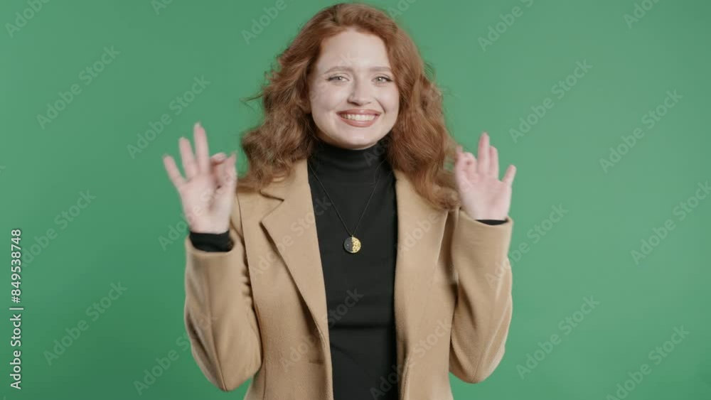 Pretty businesswoman with OKAY sign, ok. Happy lady, correct choice,green studio