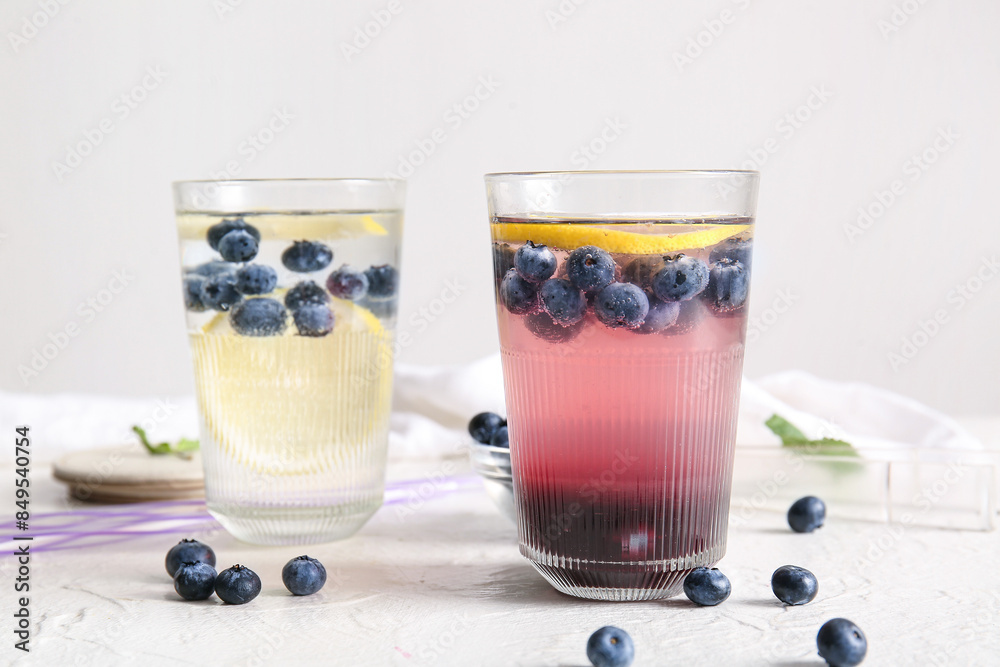 Glass of fresh blueberry lemonade on white background Glass of fresh blueberry lemonade on white background