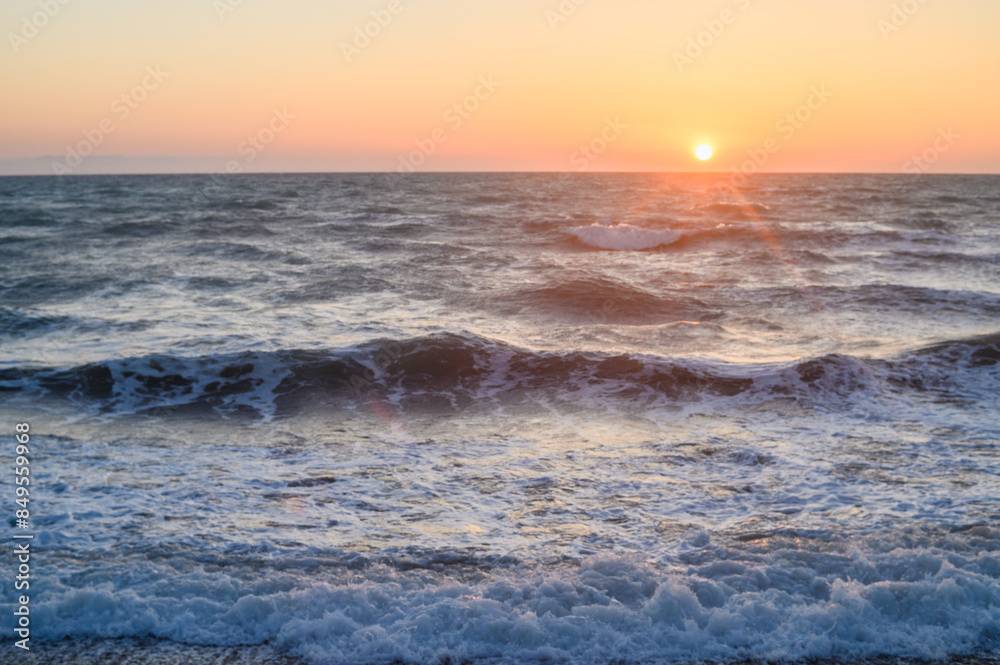 Obraz premium Sun rise at the beach. Sun rising at sea horizon. Golden hour.