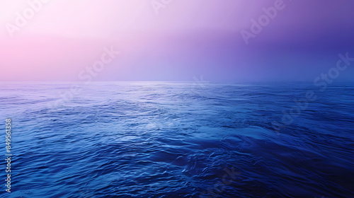 The ocean is calm and the sky is a beautiful shade of purple