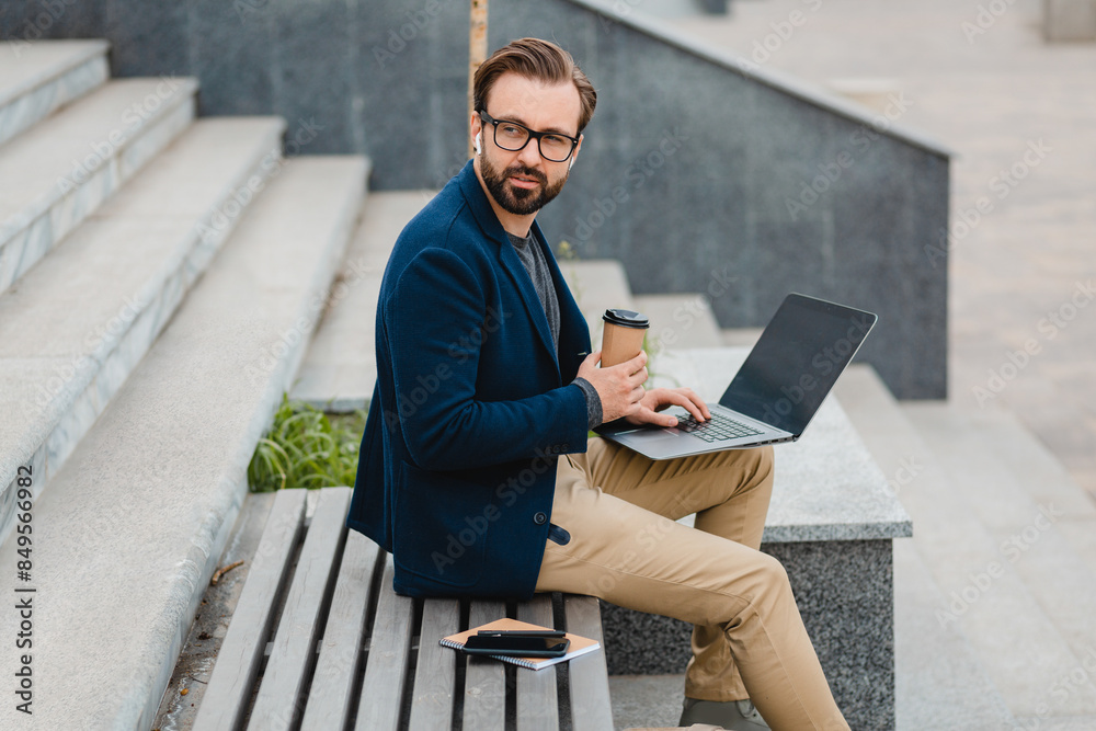 handsome busy bearded man working in park handsome busy bearded man working in park